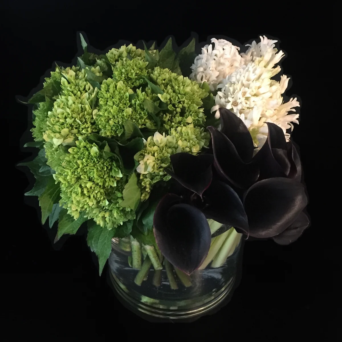 Hydrangea, hyacinth and black calla lilies