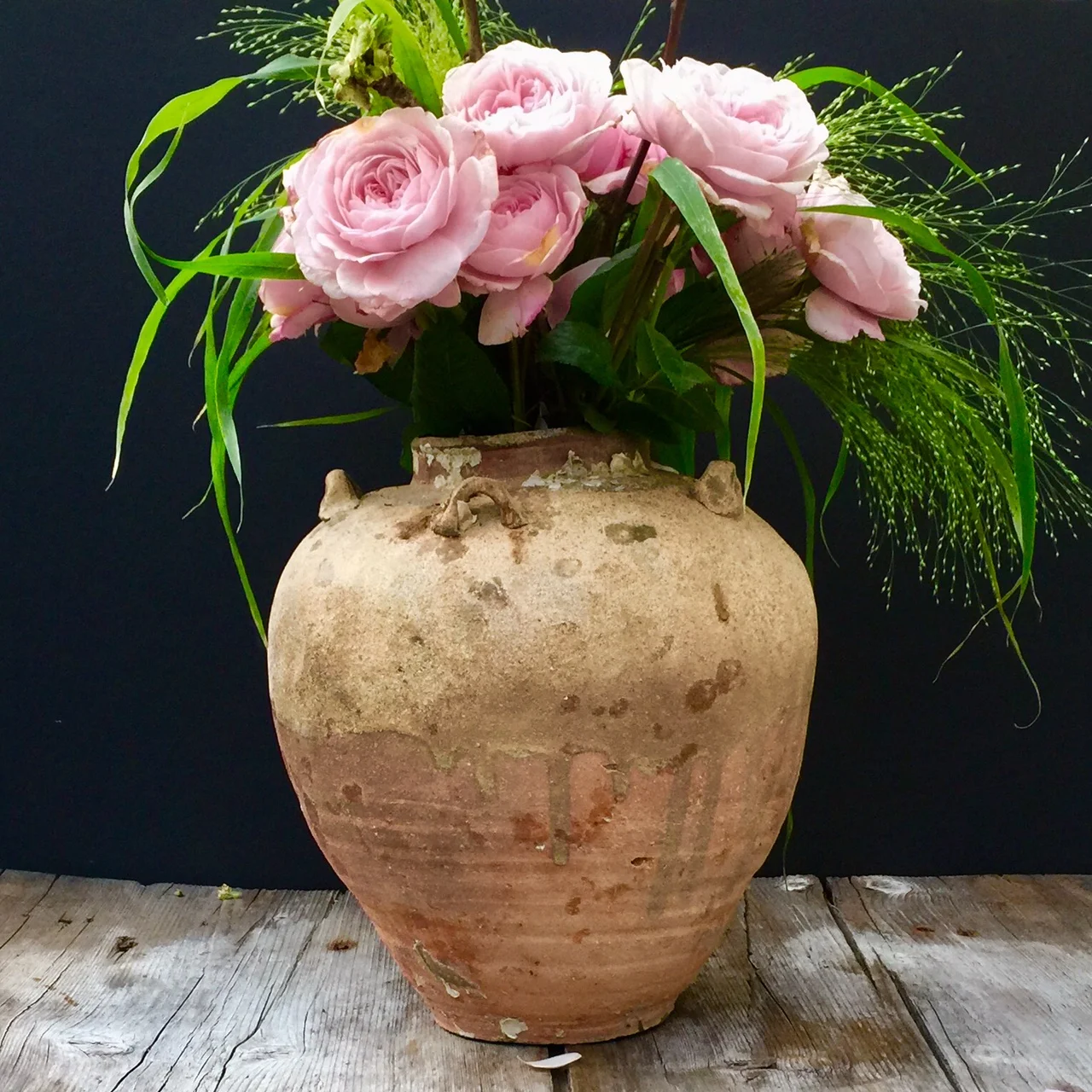 Blush roses in an antique jar